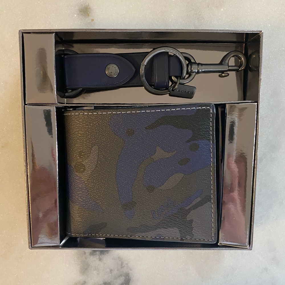Coach men’s wallet and matching keychain set.